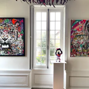 Super girl by Jo di Bona, 120x100cm, mixed media and Kong barrel by Richard Orlinski