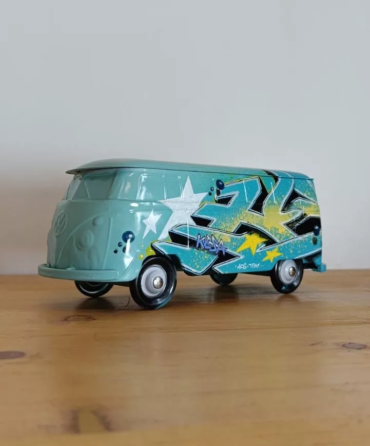 Blue metal WV combi tagged II painted by Kesa Graffiti